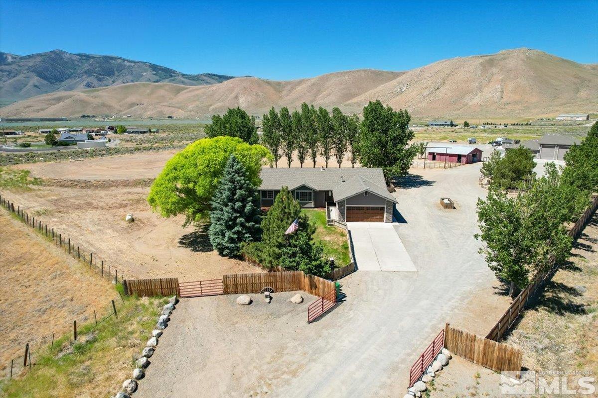 an aerial view of a house with a garden