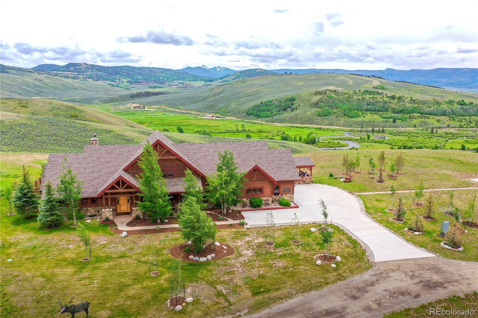 aerial view of residential houses with outdoor space and ocean view