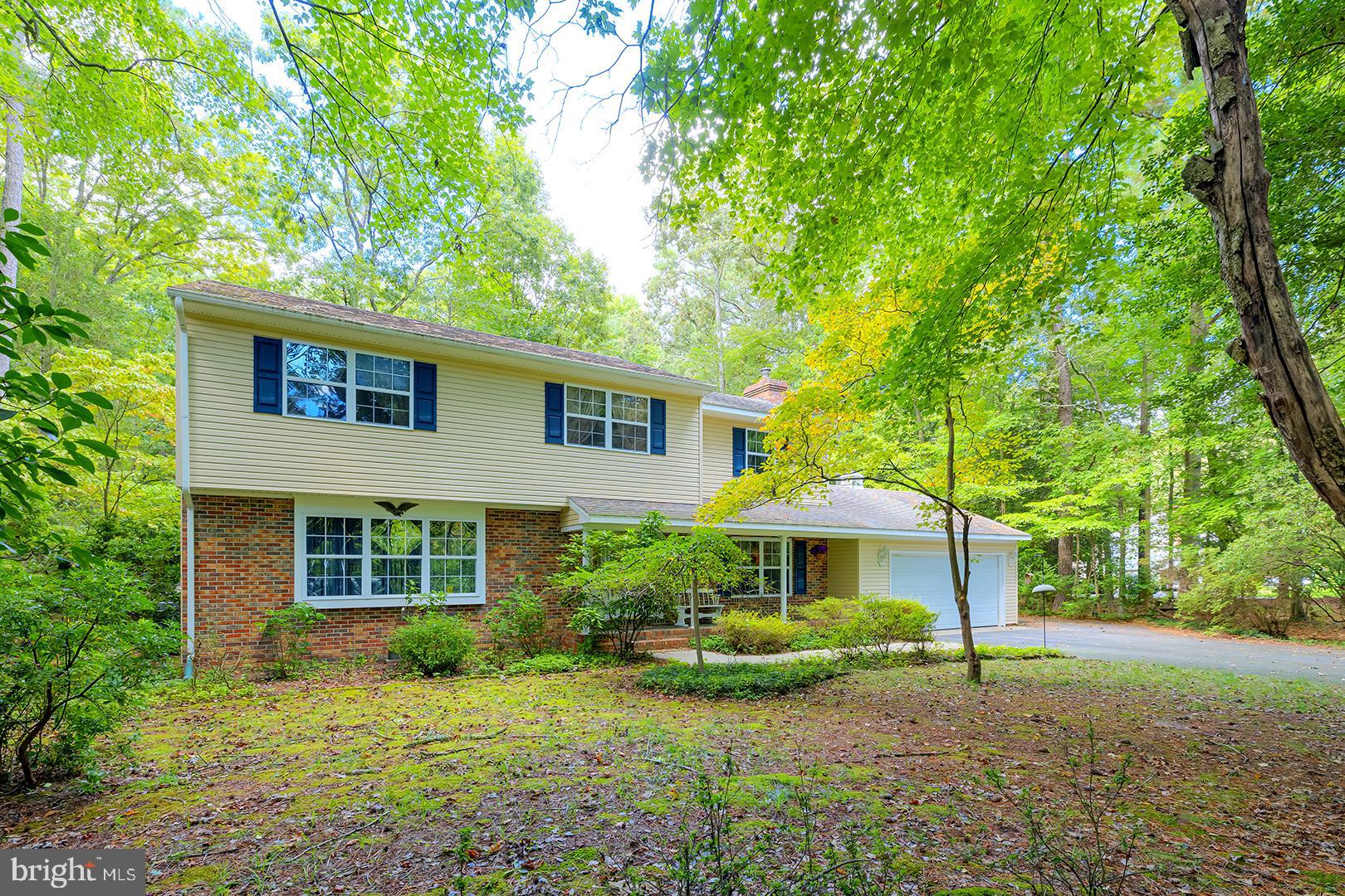 a front view of a house with a yard and porch