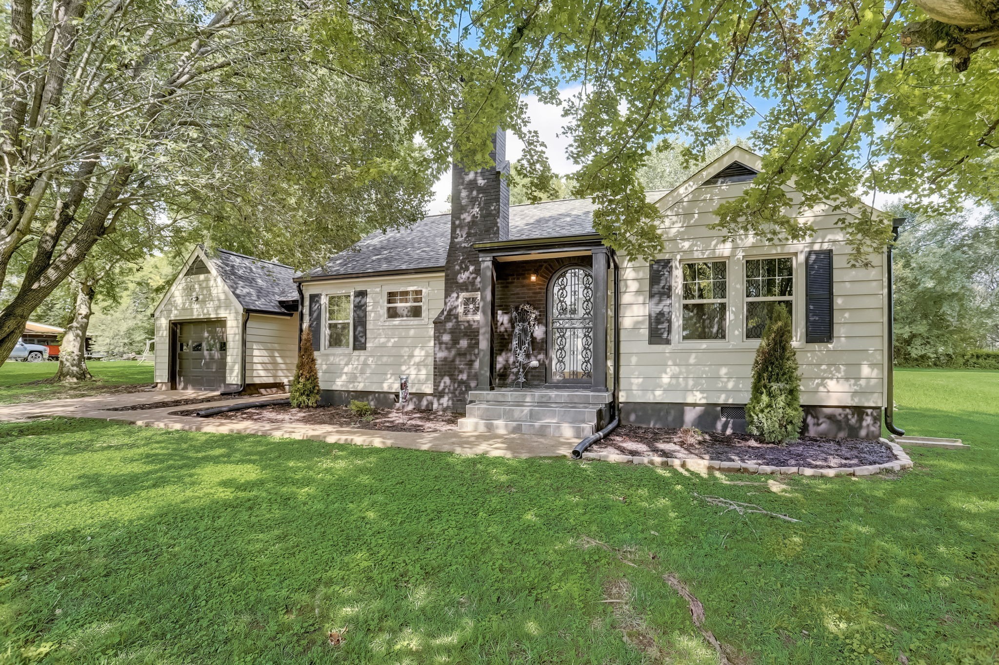 front view of a house with a yard