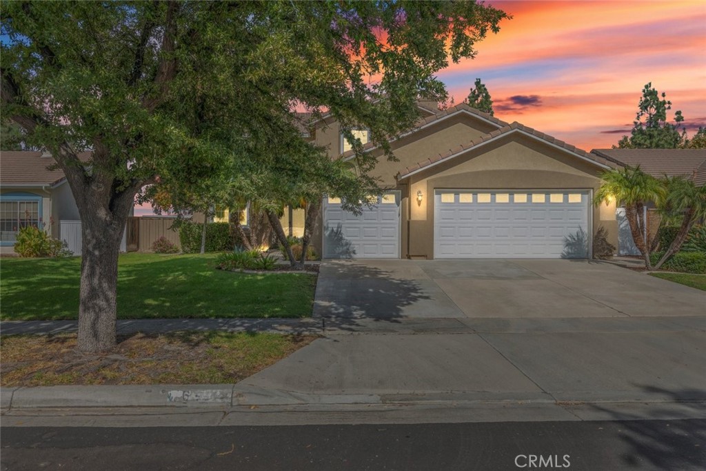 A beautiful two-story home, featuring manicured landscaping and dual garages, located in a phenomenal neighborhood.