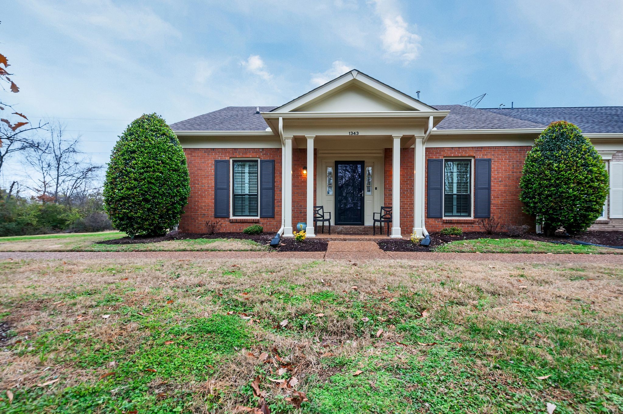 front view of a house with a yard