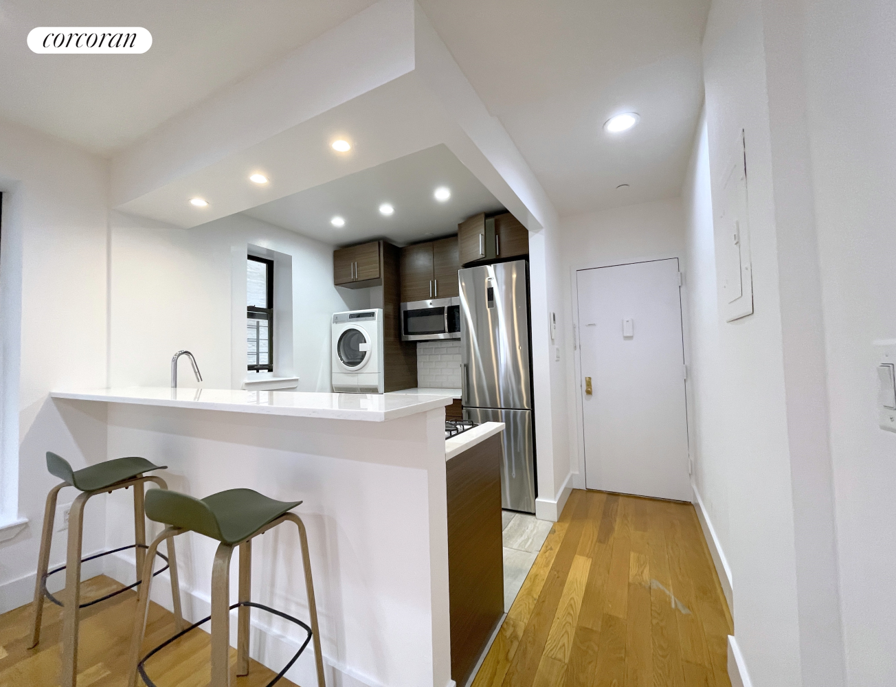 a kitchen with stainless steel appliances a sink stove and refrigerator