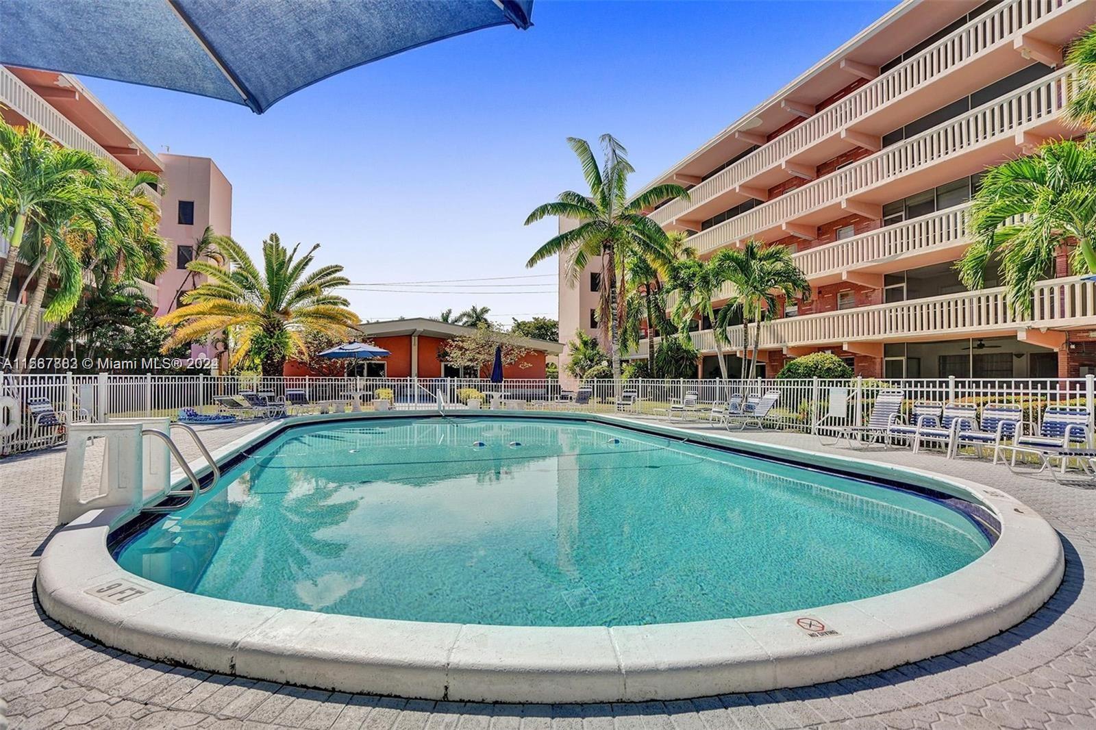 a view of a swimming pool with a sitting space