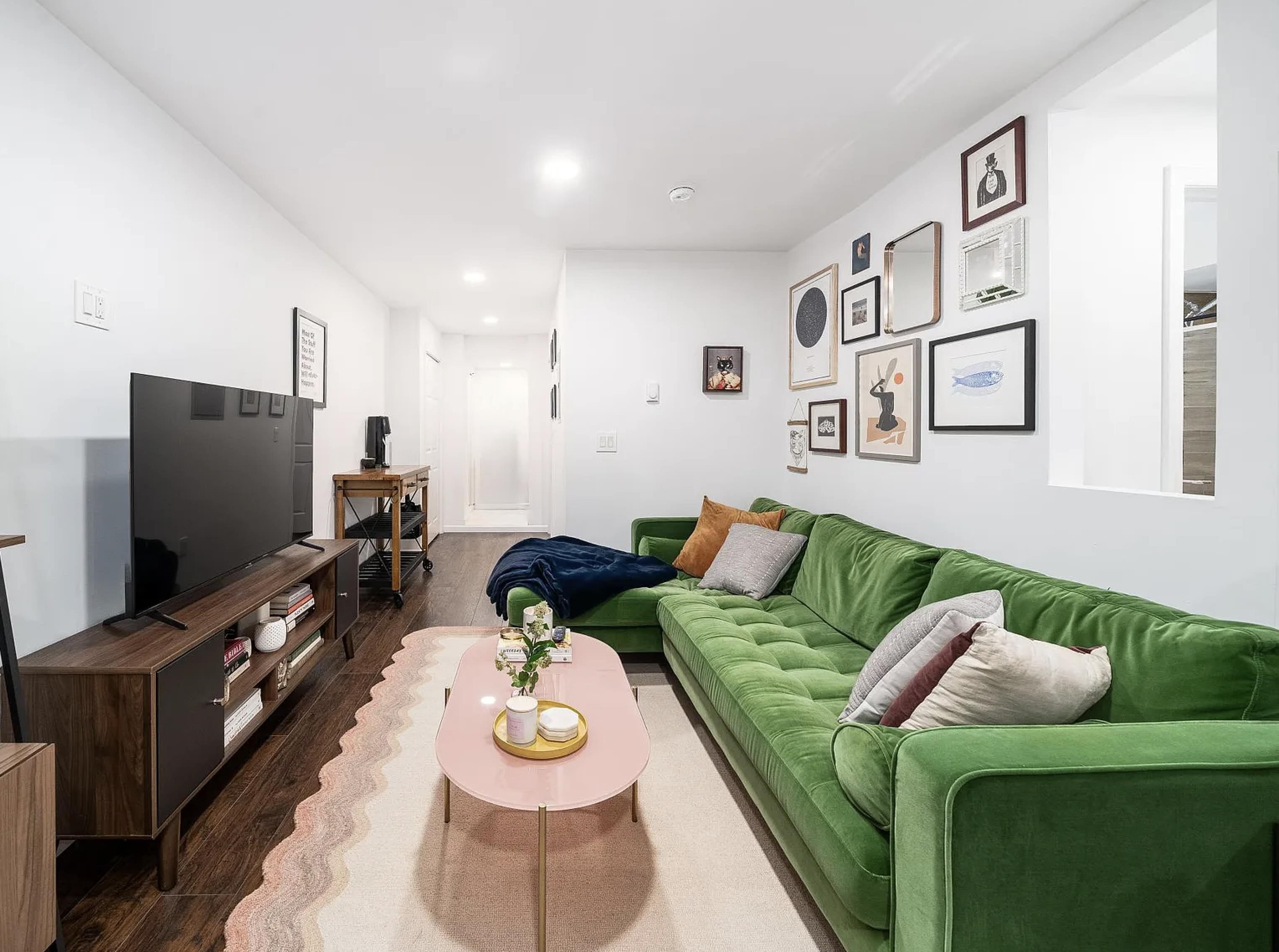 a living room with furniture and a flat screen tv