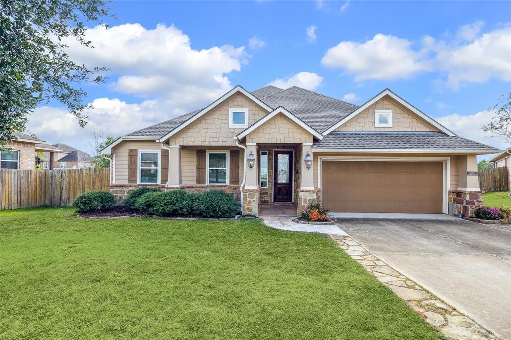 Impressive curb appeal with a welcoming front porch, manicured landscaping, and a charming exterior that invites you home.