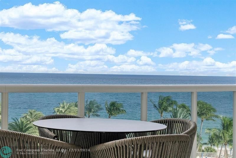 a view of a balcony with furniture