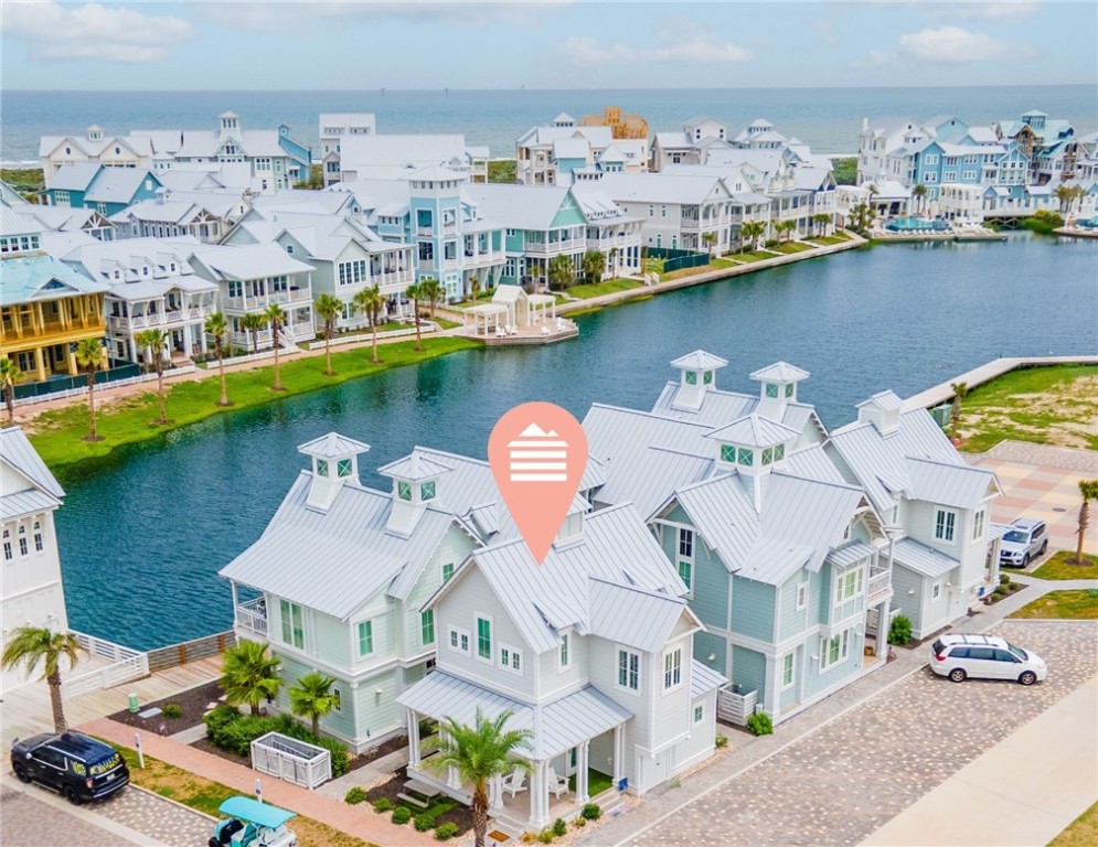 an aerial view of a house with a ocean view