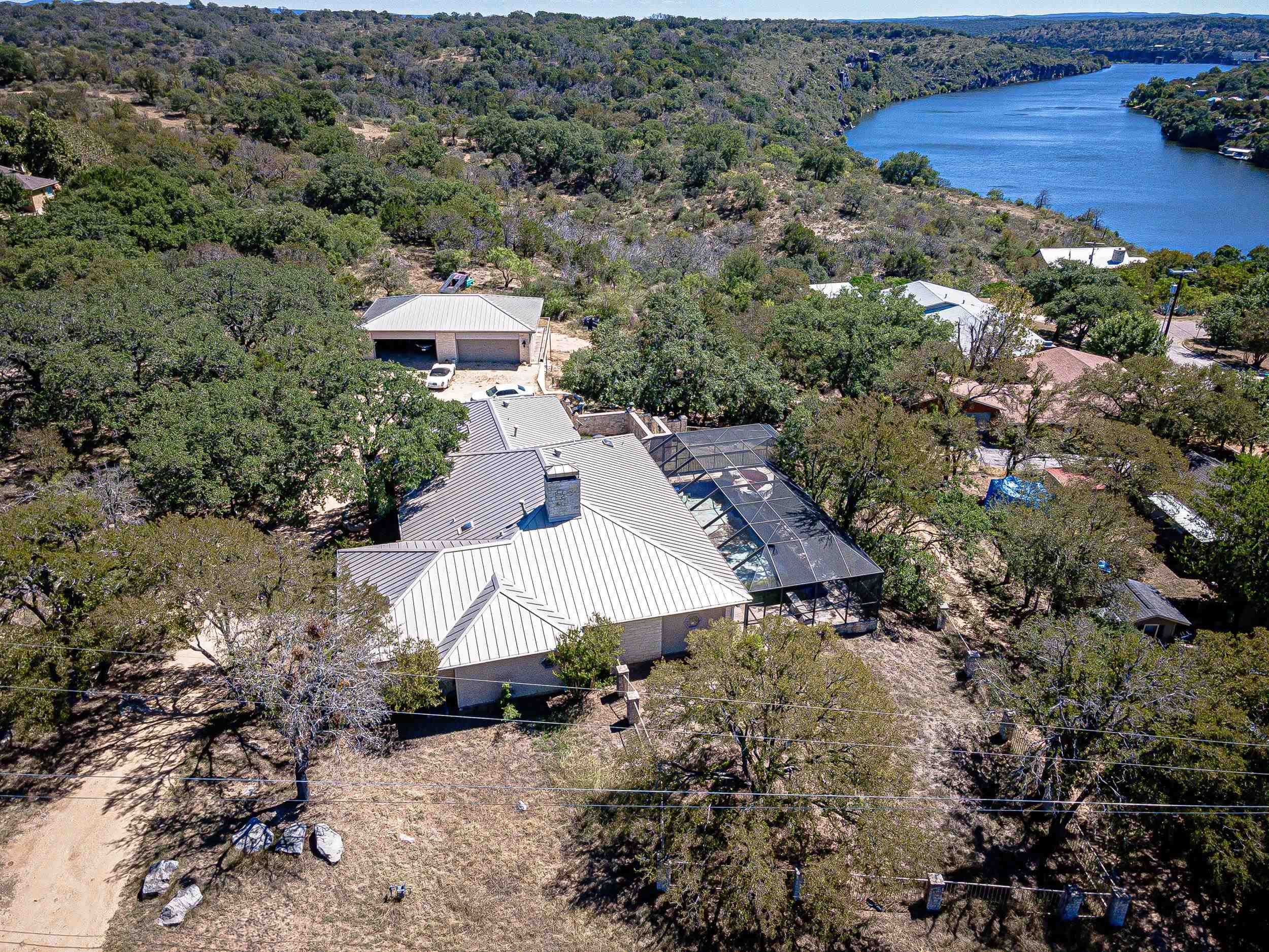 an aerial view of a house with a yard