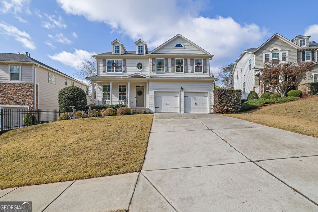 a front view of a house with a yard