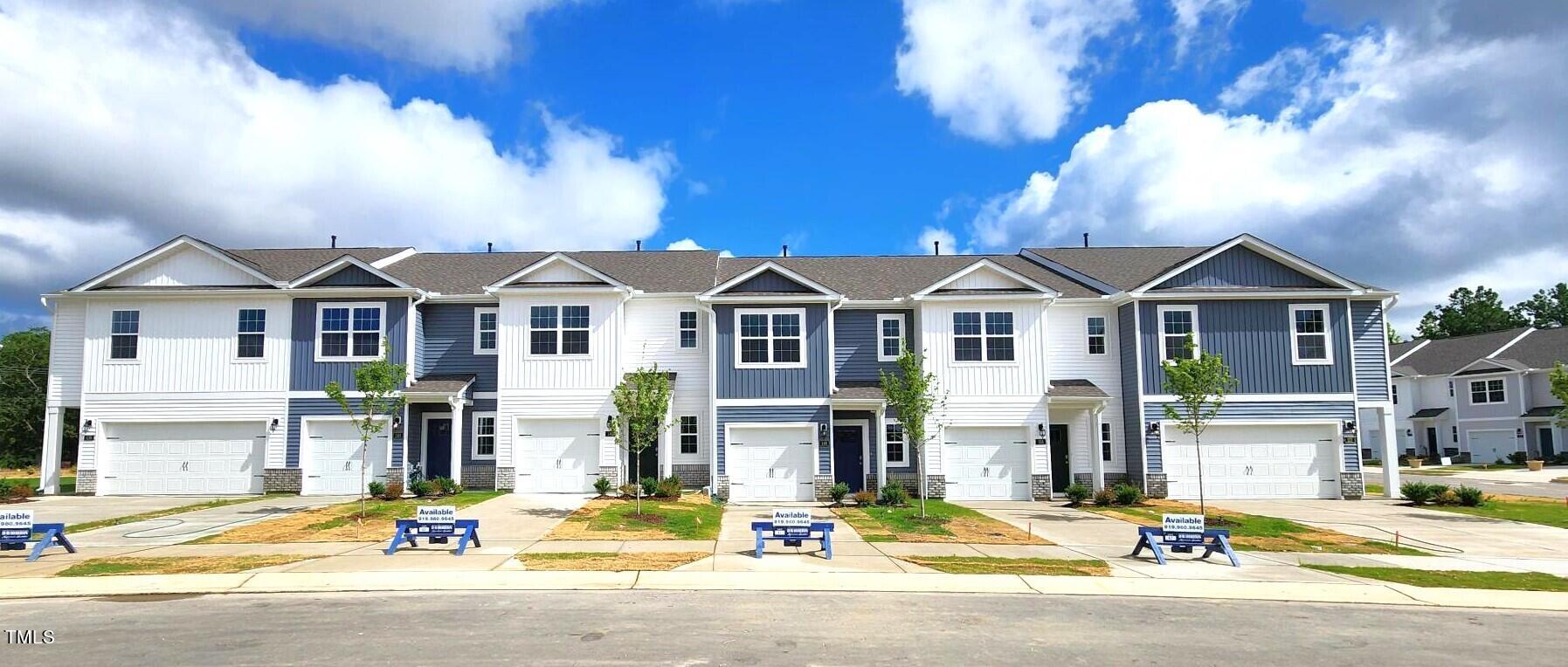 a very nice looking house with a large windows and a table and chairs