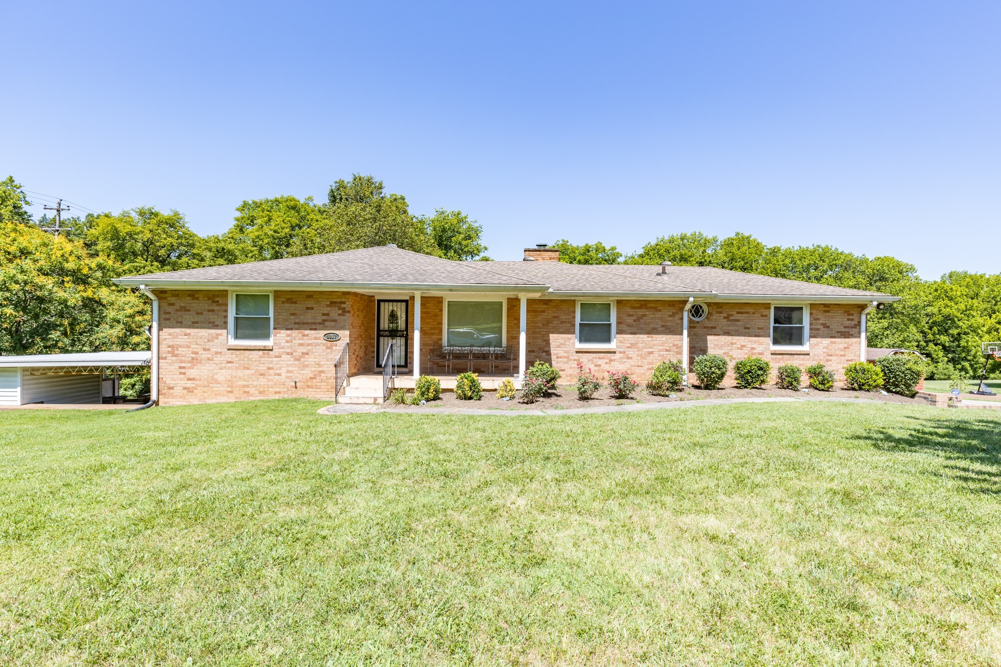 front view of a house with a yard