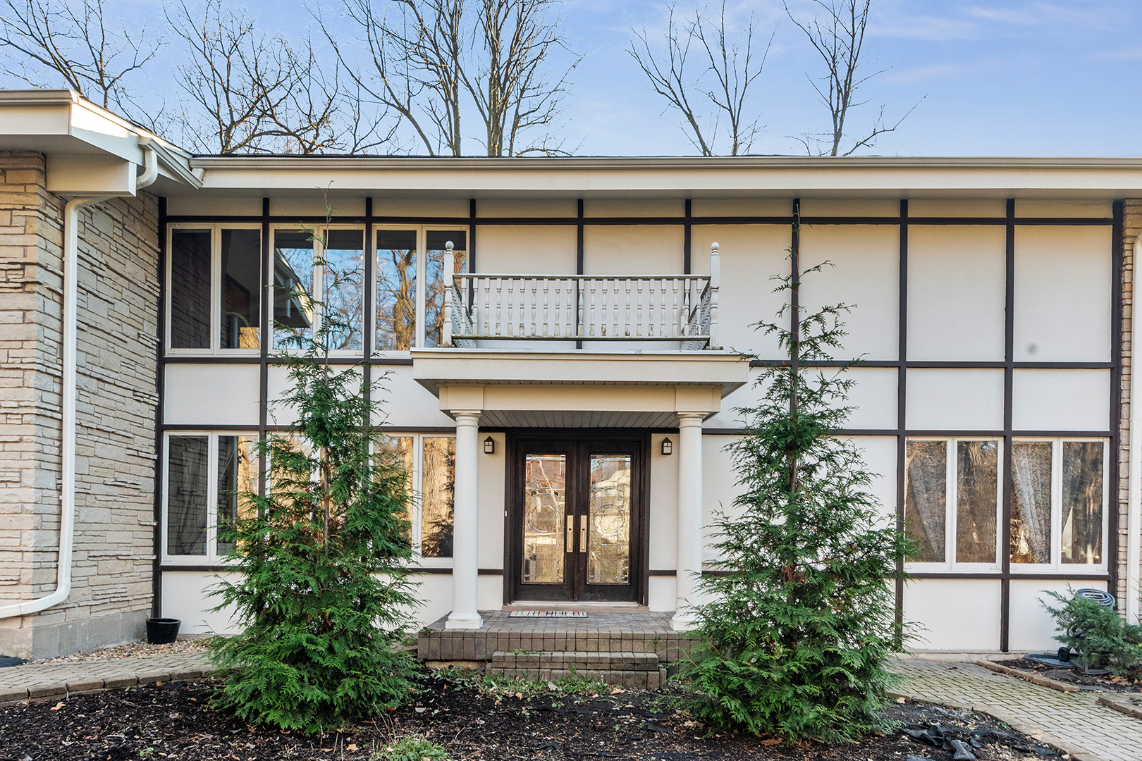 a front view of a house with garden