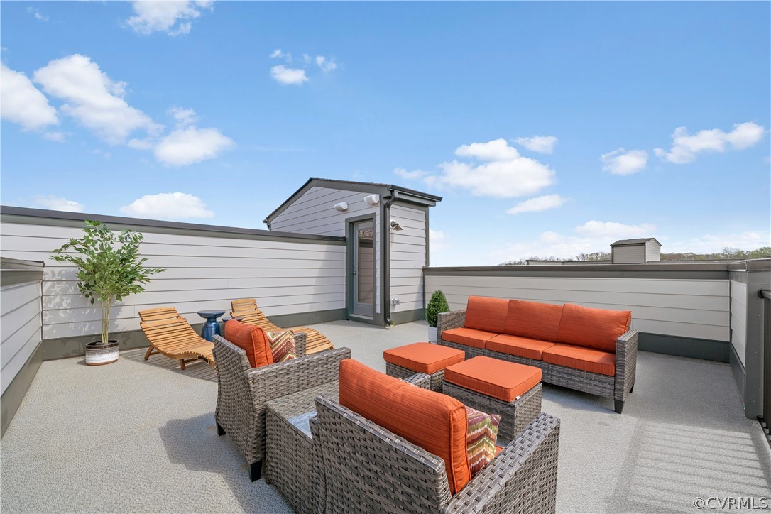 a outdoor living space with patio furniture and a potted plant