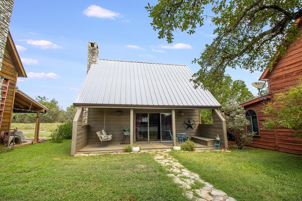 a front view of a house with a garden and porch