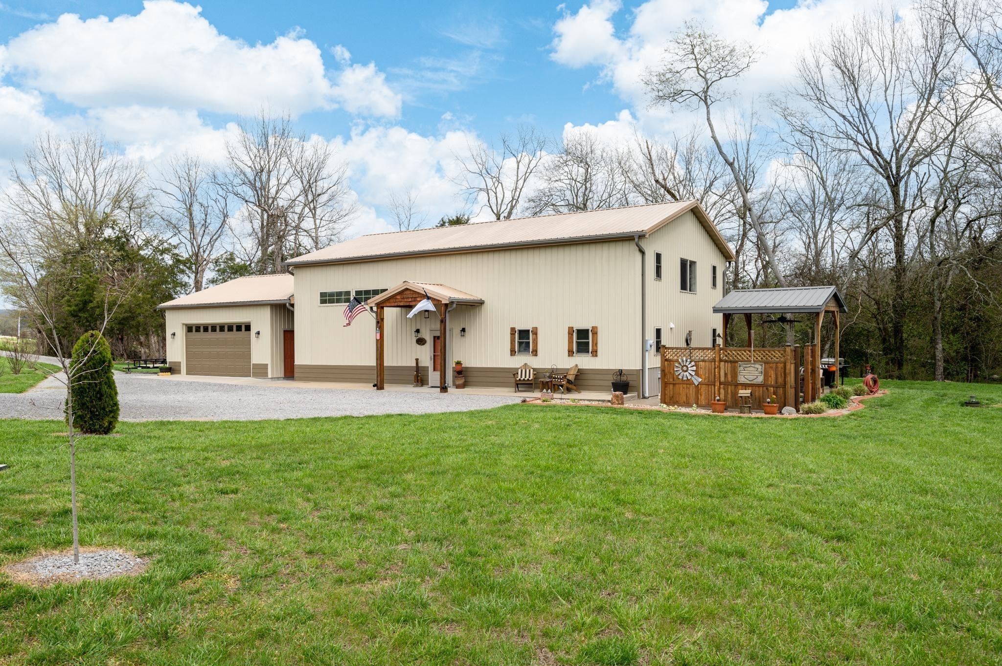 a view of a house with backyard porch and garden