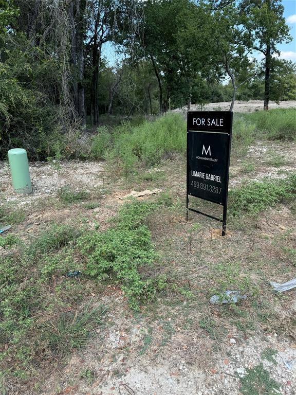 a sign that is sitting in the middle of a forest