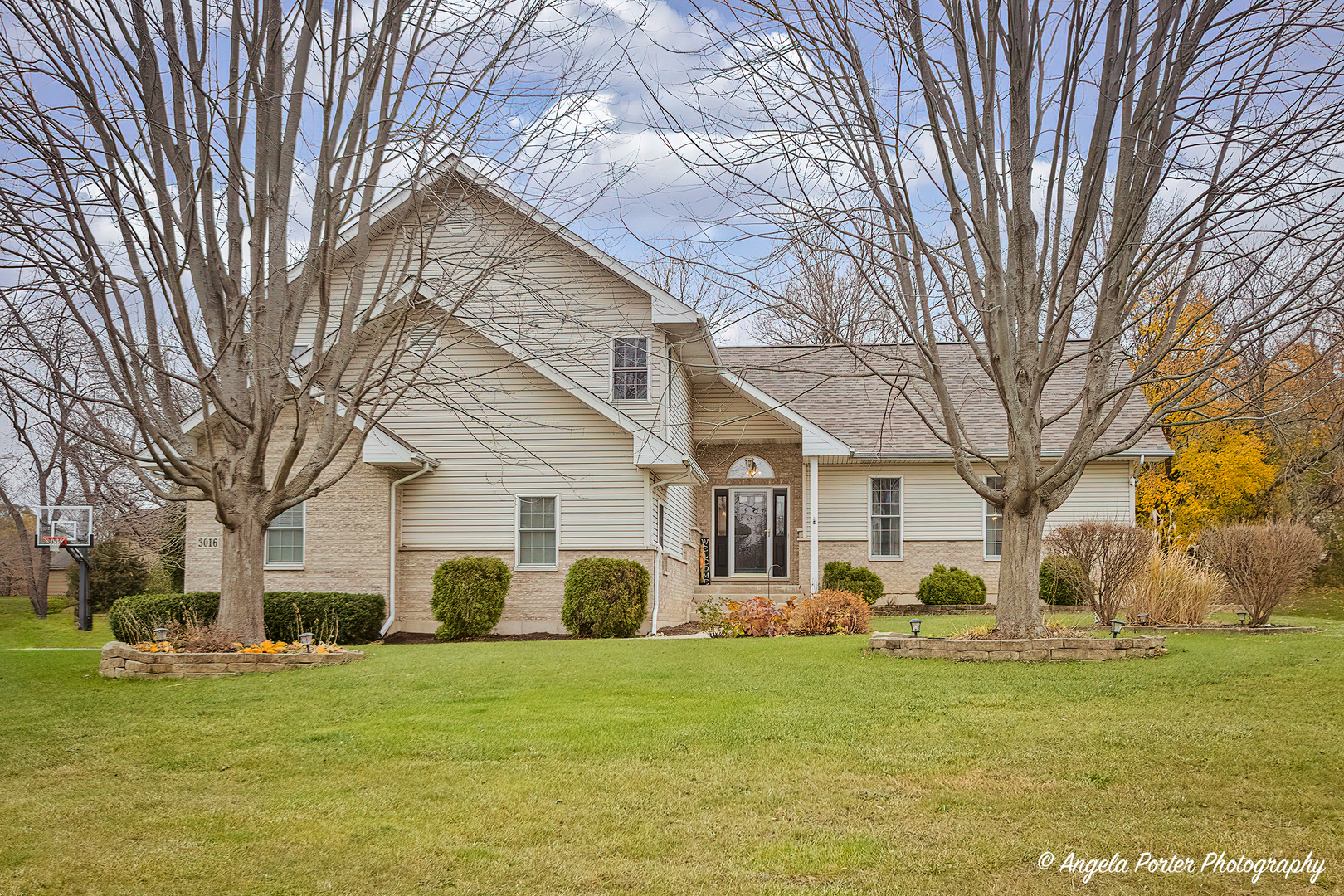 a front view of a house with a yard