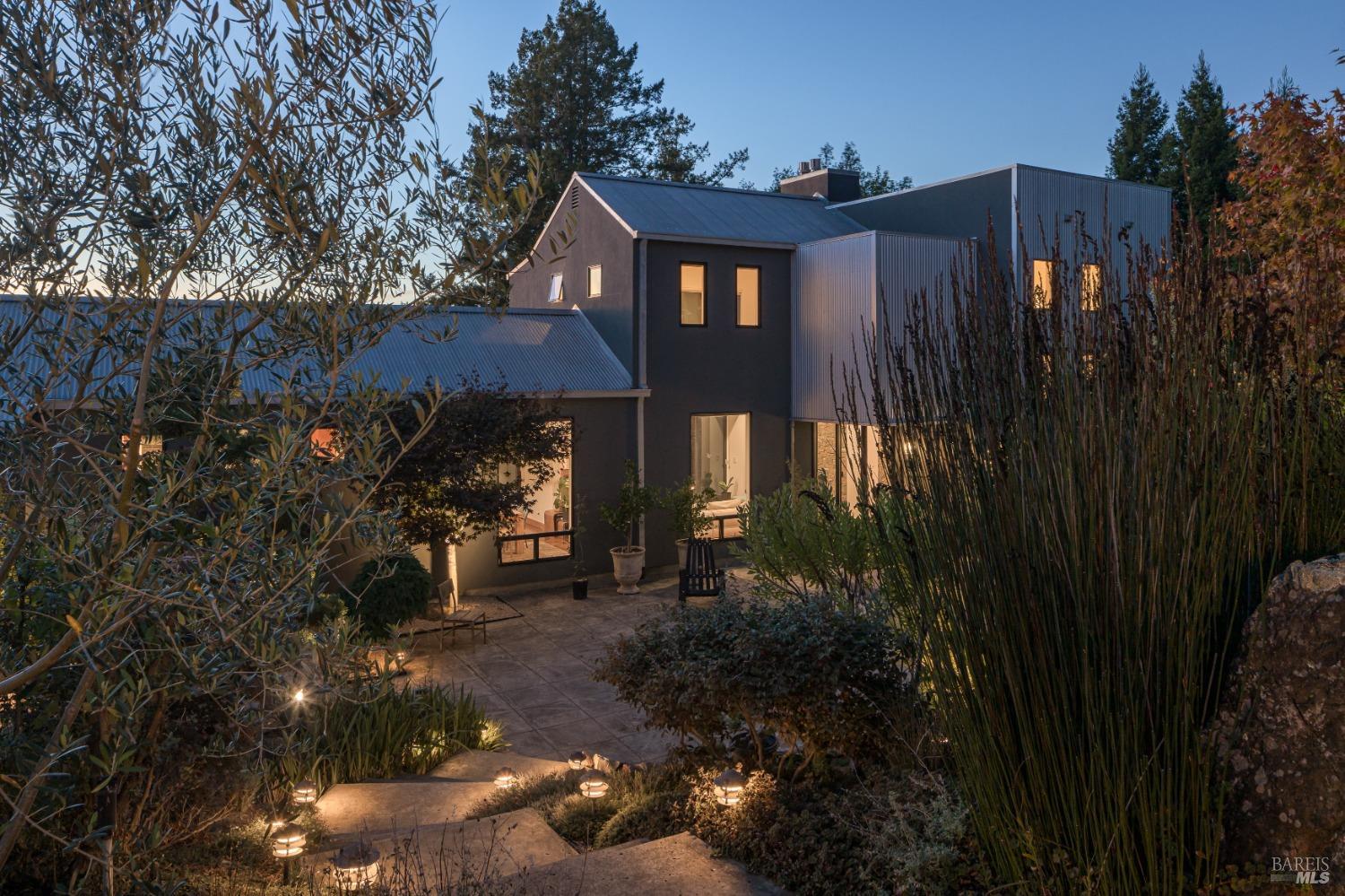 a view of a house with a yard and tree s