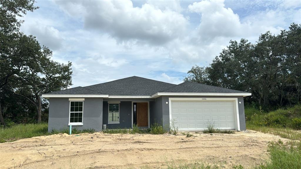 front view of a house with a yard