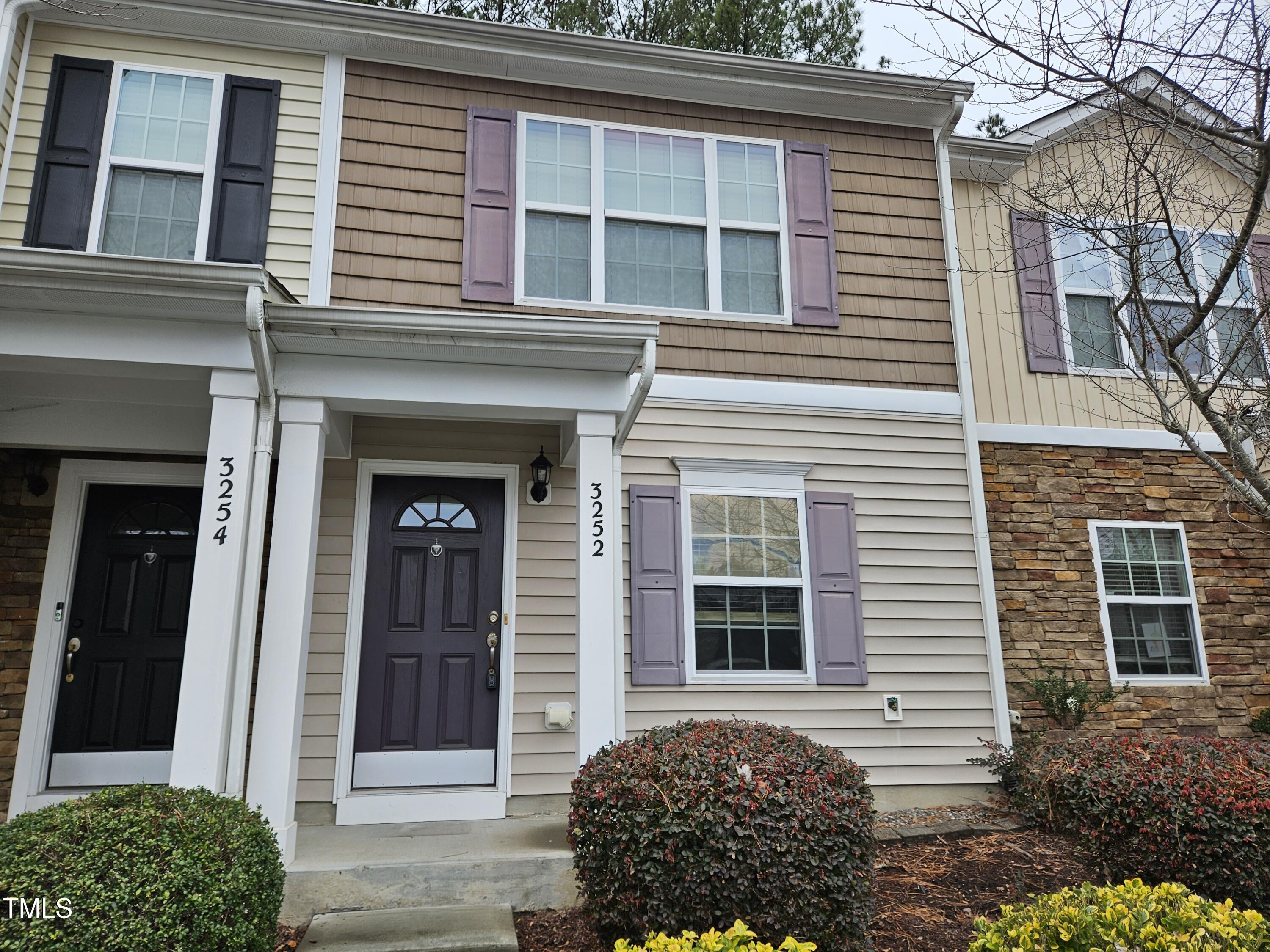 a view of a house with a door and a window