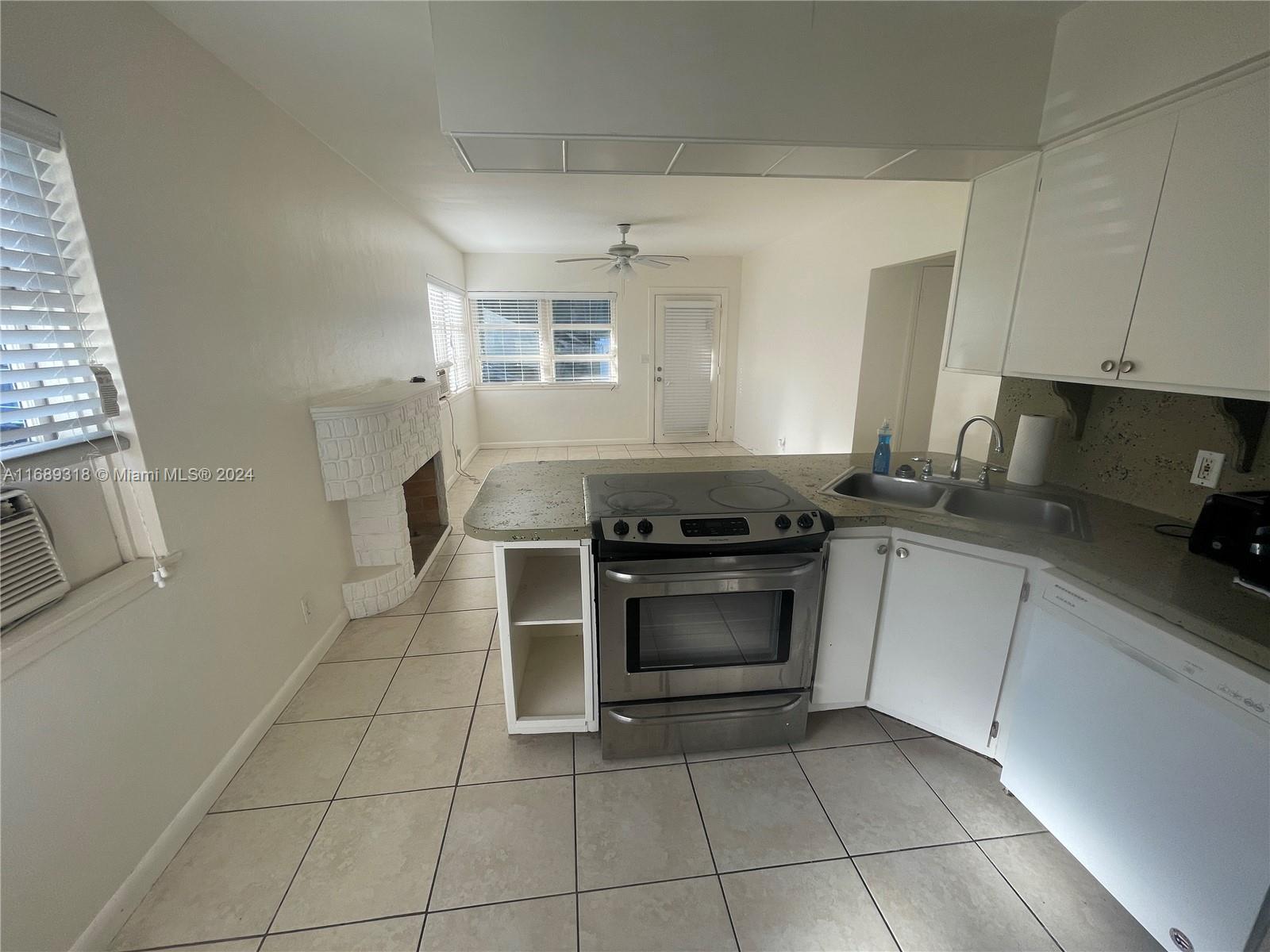 a kitchen with a stove and a sink