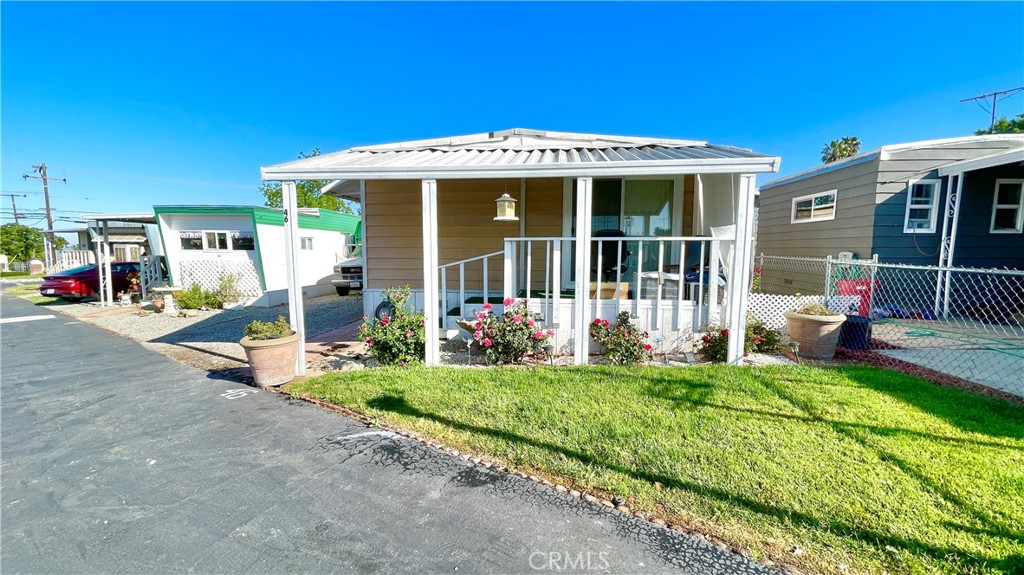 a front view of a house with a yard and porch