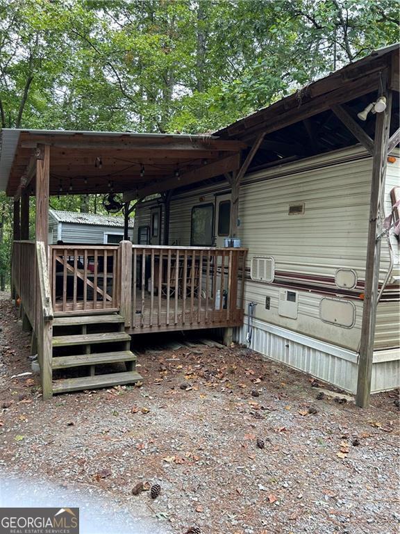 a view of outdoor space with deck and yard