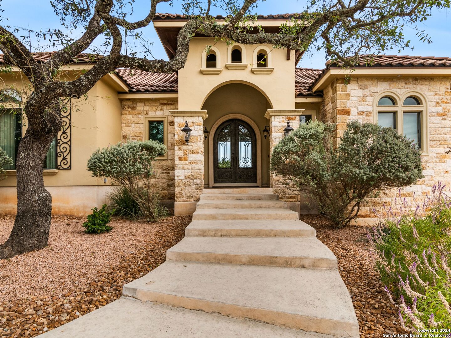 a front view of a house with garden