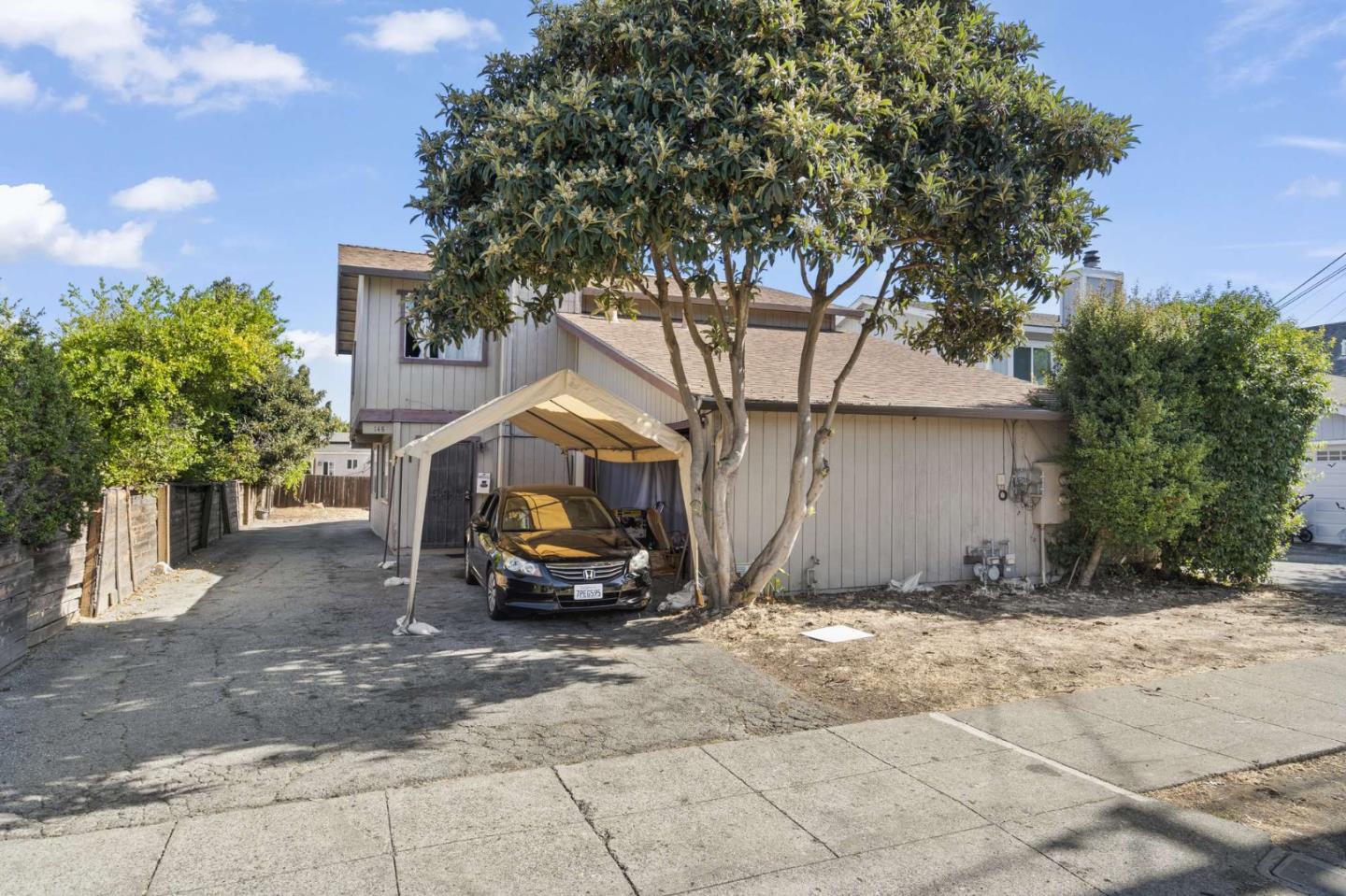 a view of a car parked in front of house