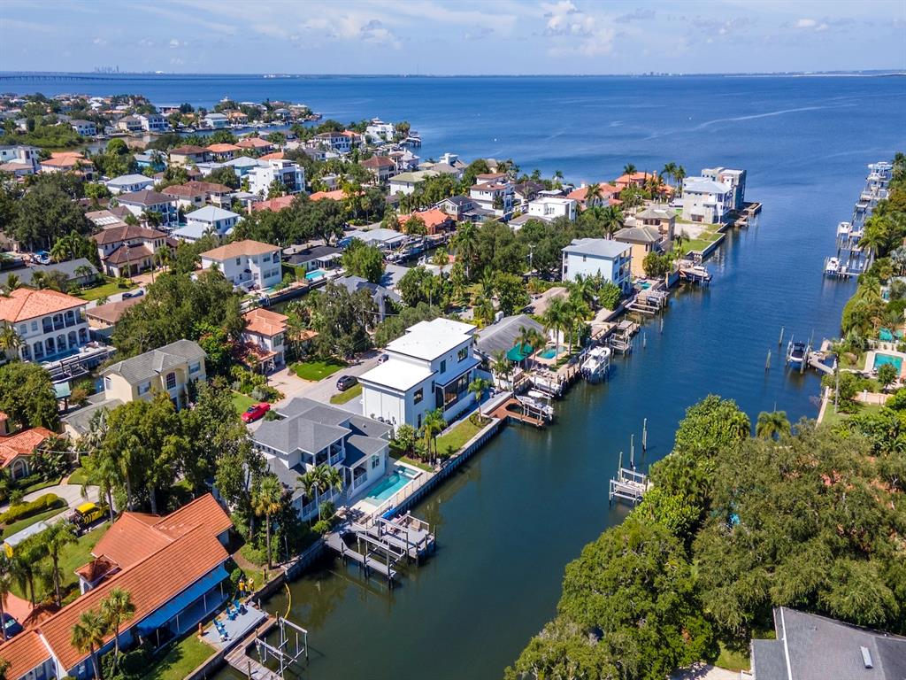 an aerial view of a house with a lake view