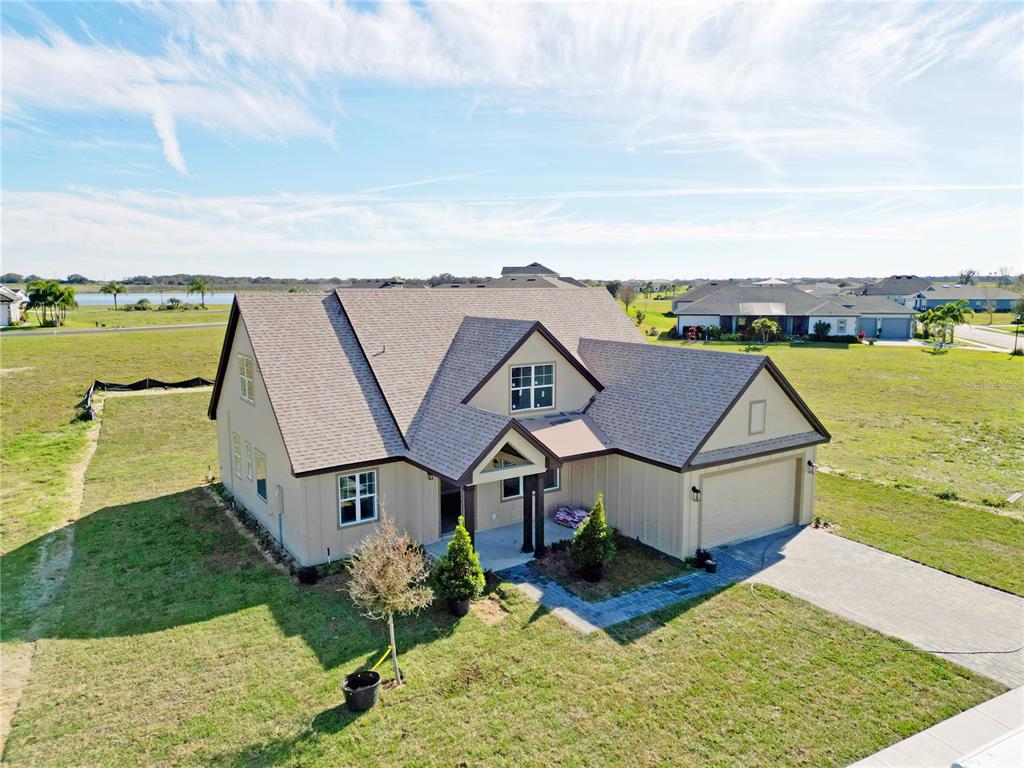 an aerial view of houses with yard