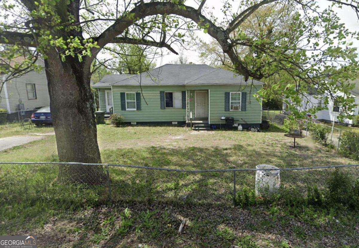 a front view of a house with yard