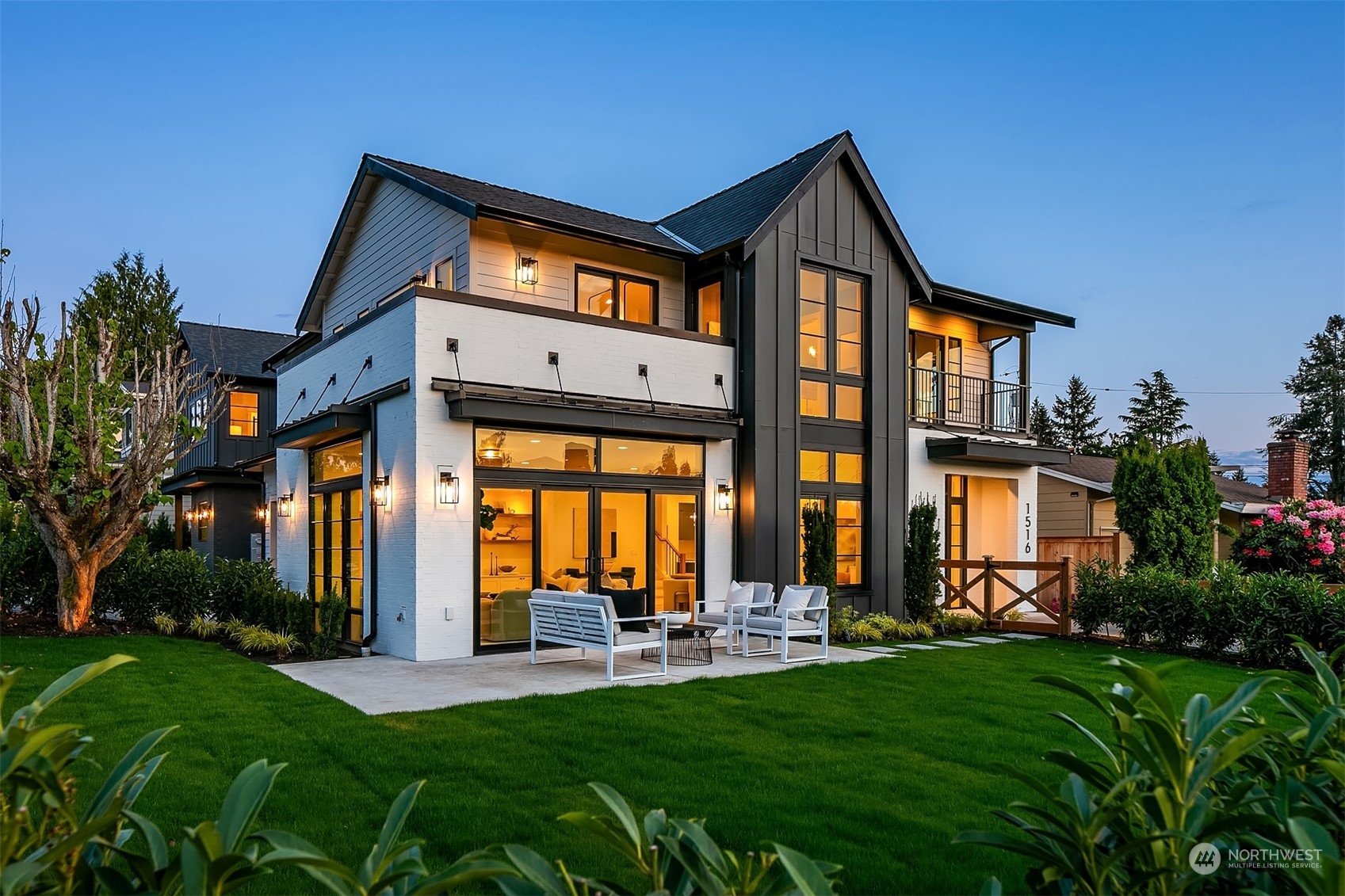 a front view of house with yard and outdoor seating