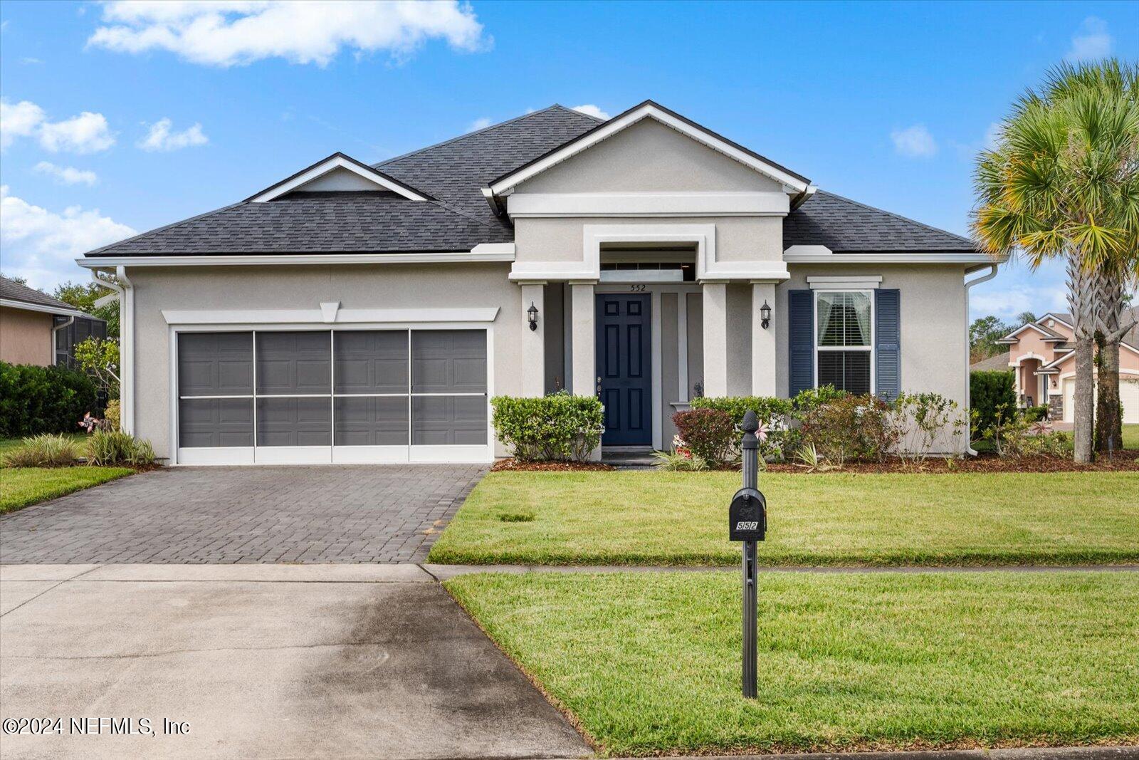 a front view of a house with a yard