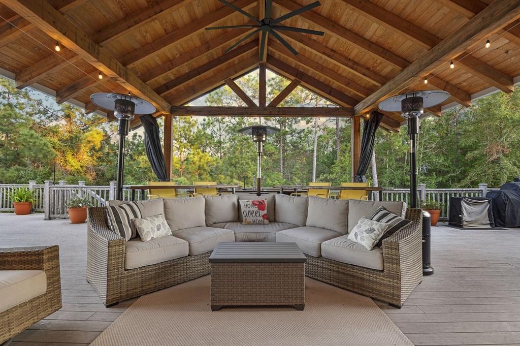 a outdoor living space with patio furniture and a fireplace