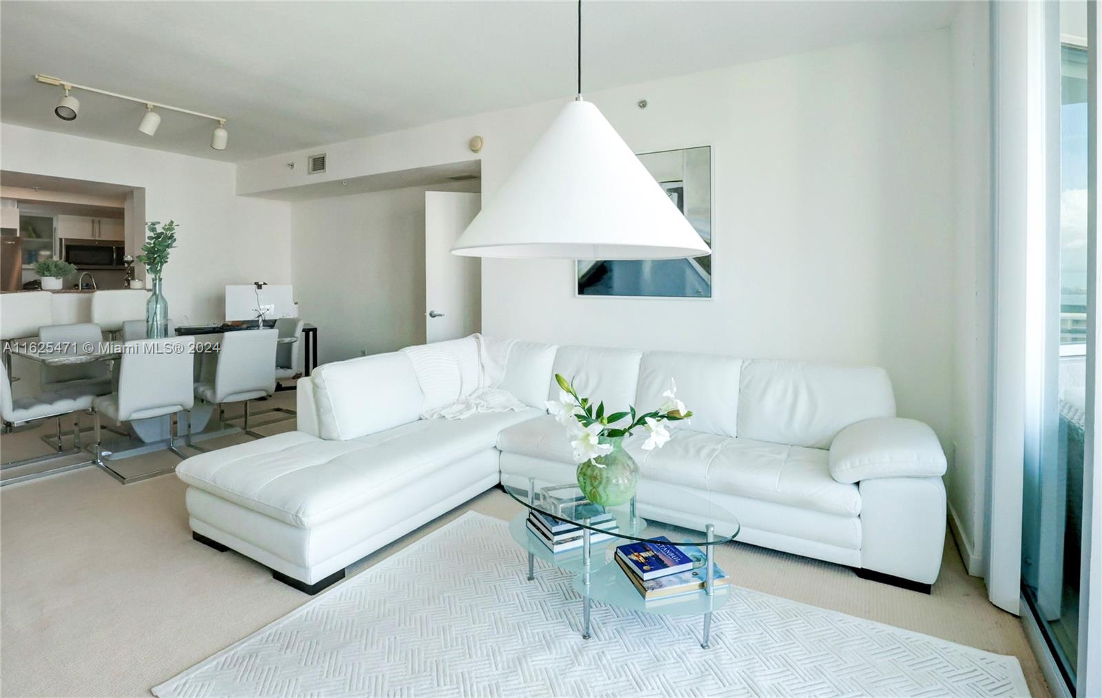 a living room with furniture and a table