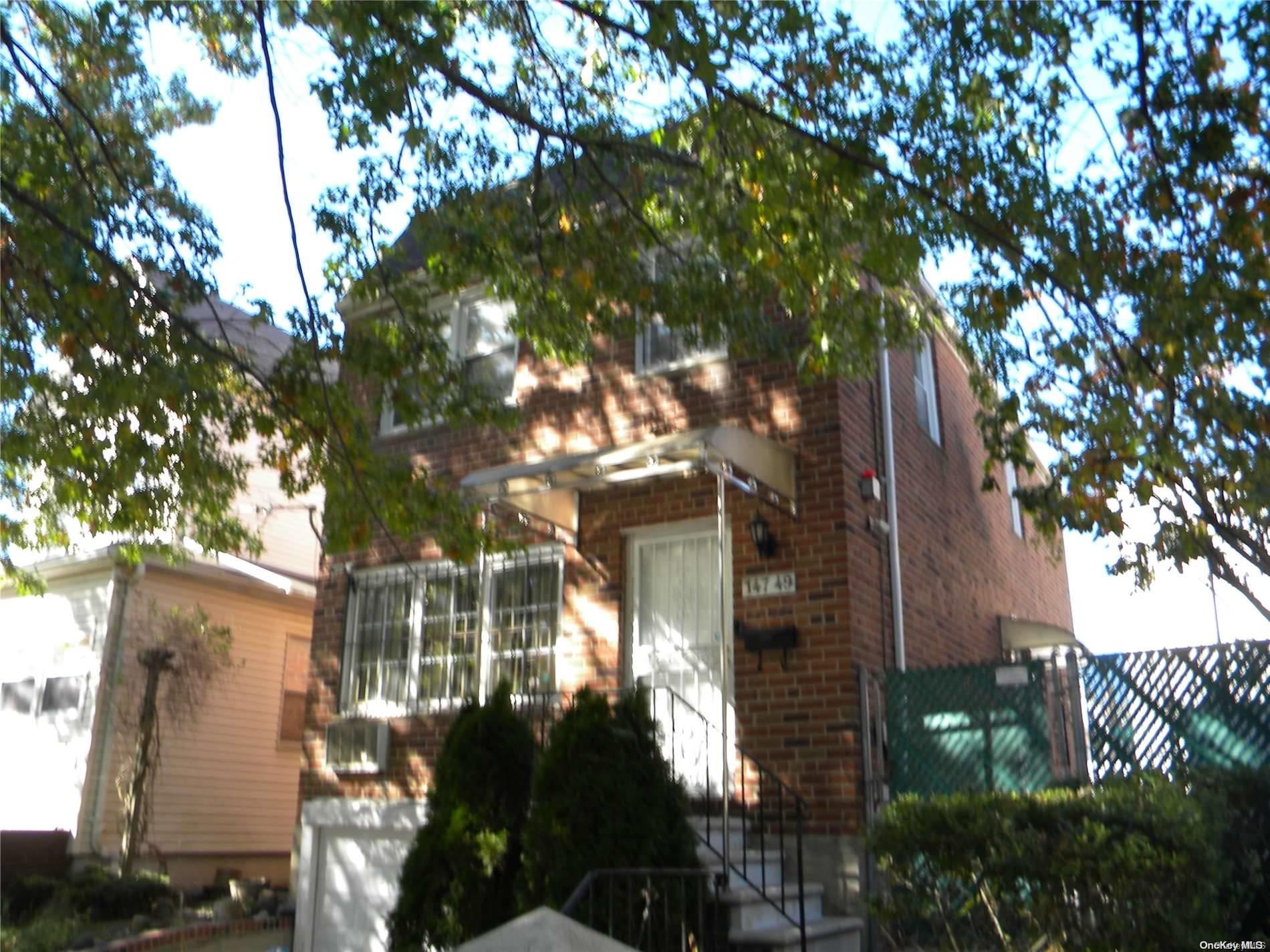 a view of a house with a tree