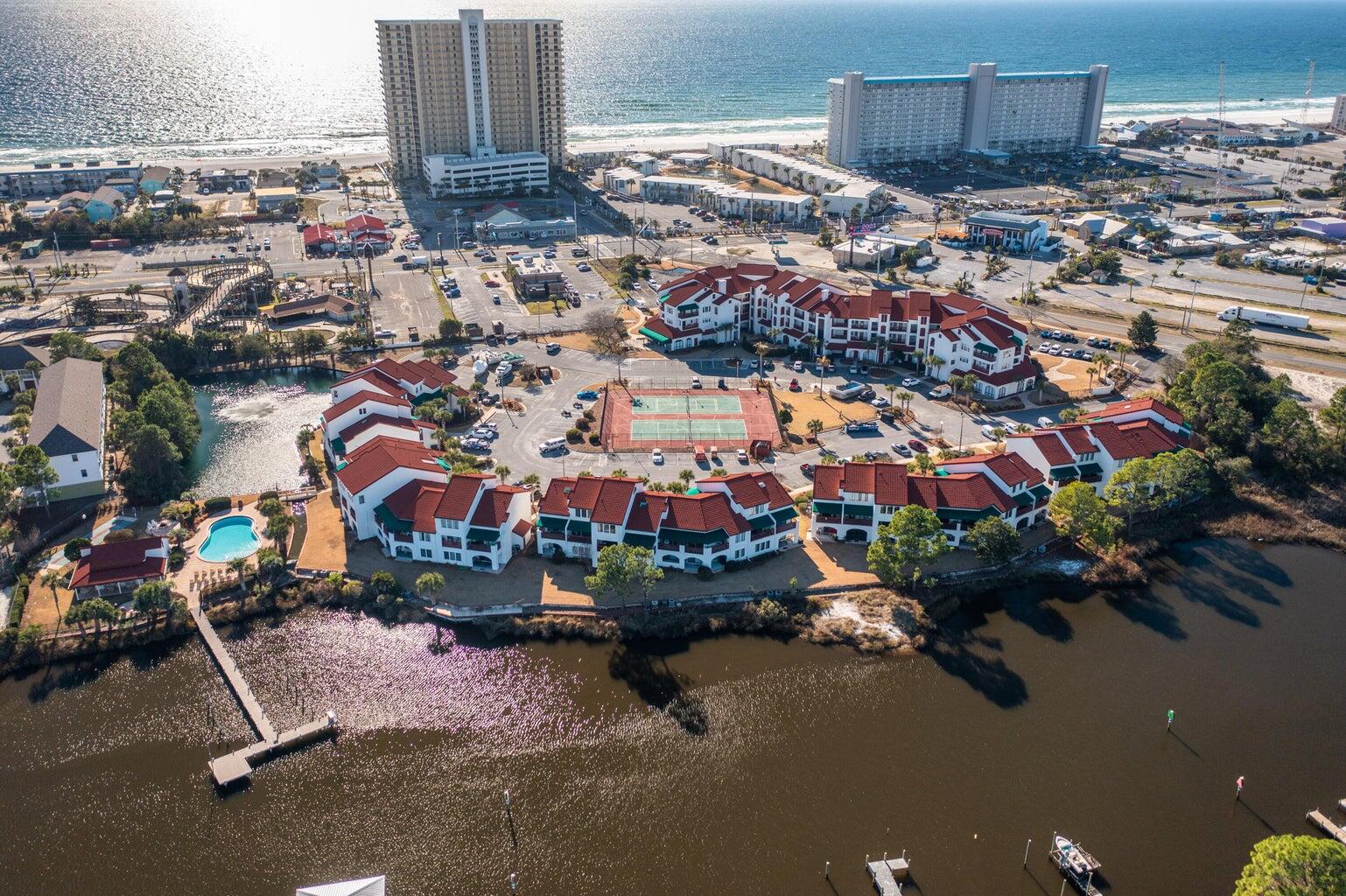 an aerial view of residential houses with outdoor space