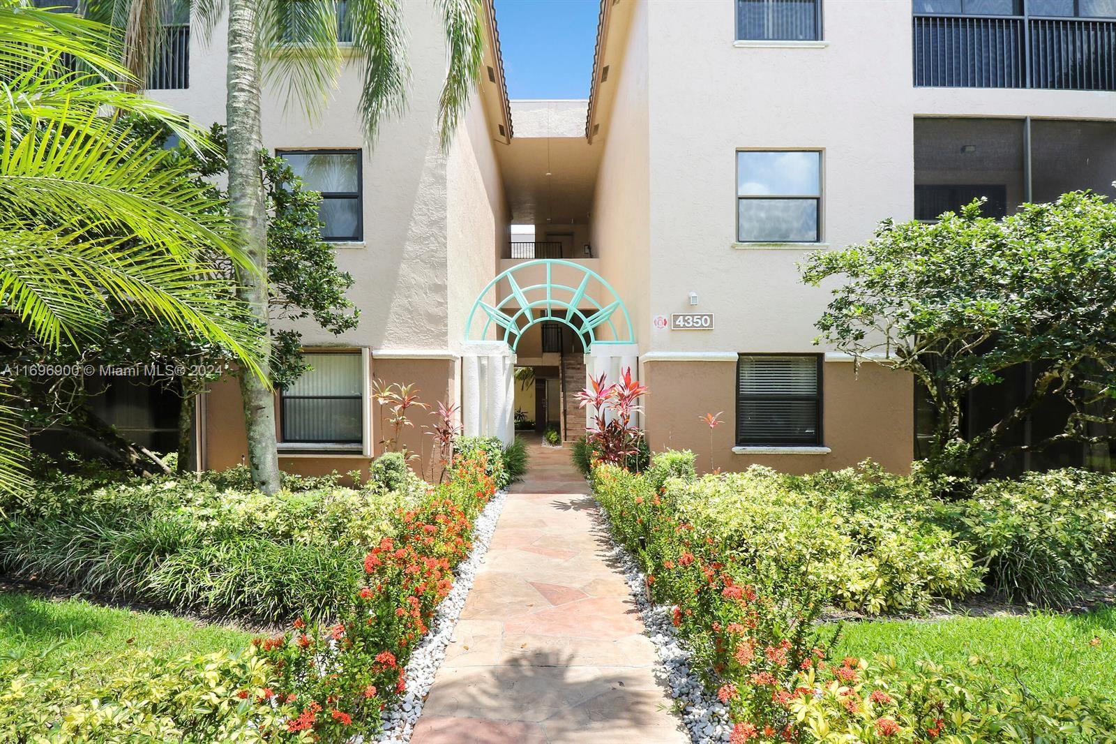 front view of a house with potted plants