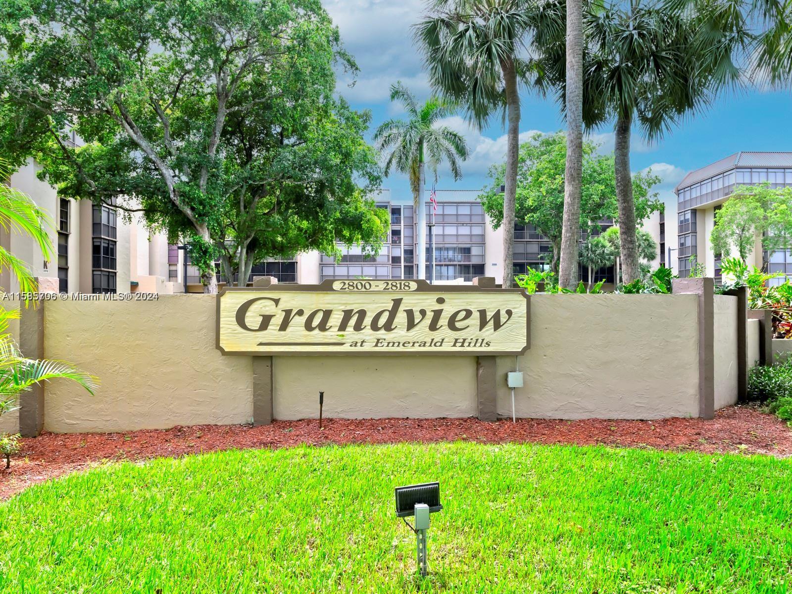 a street sign that is sitting in front of house