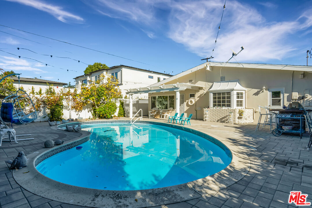 a view of a house with swimming pool