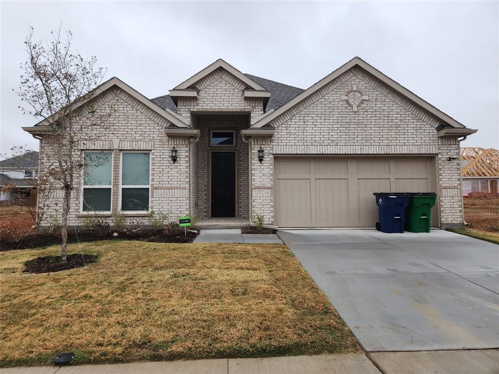 a front view of a house with garage