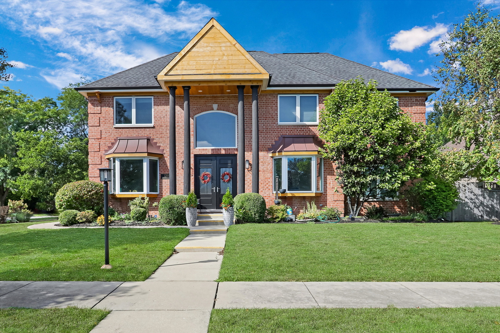 a front view of a house with a yard