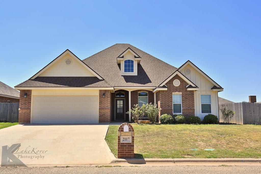 a front view of a house with yard