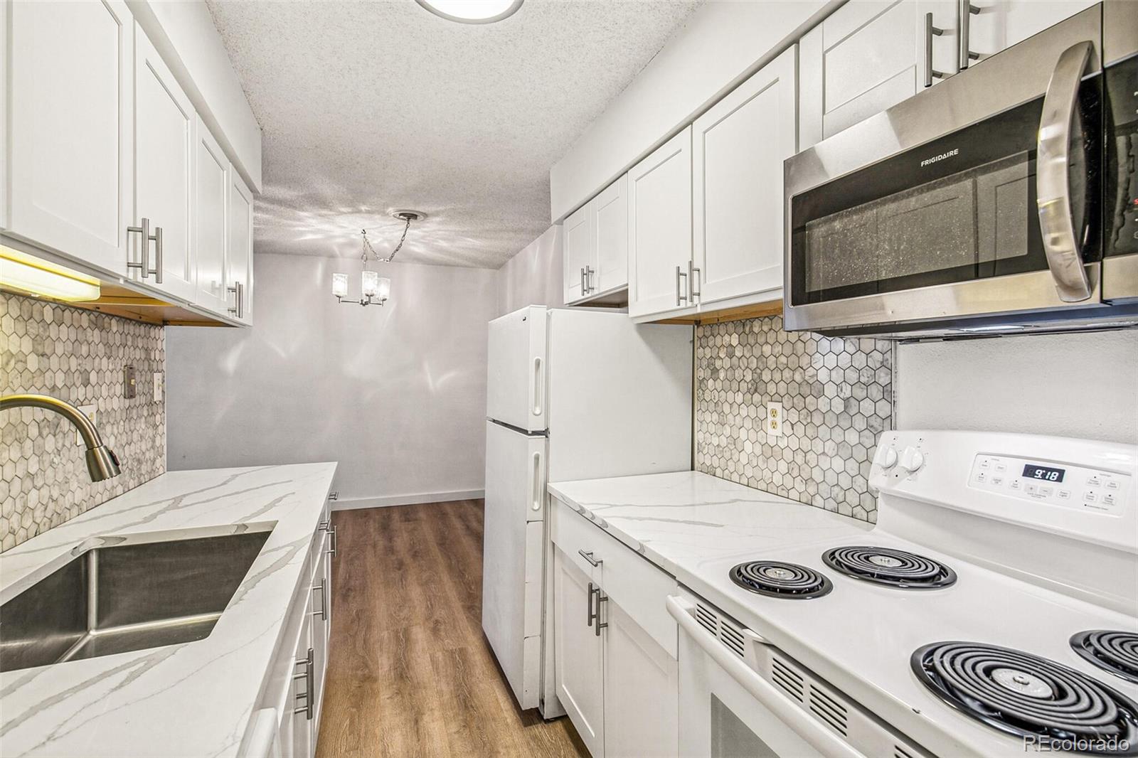 a kitchen with a stove and a microwave