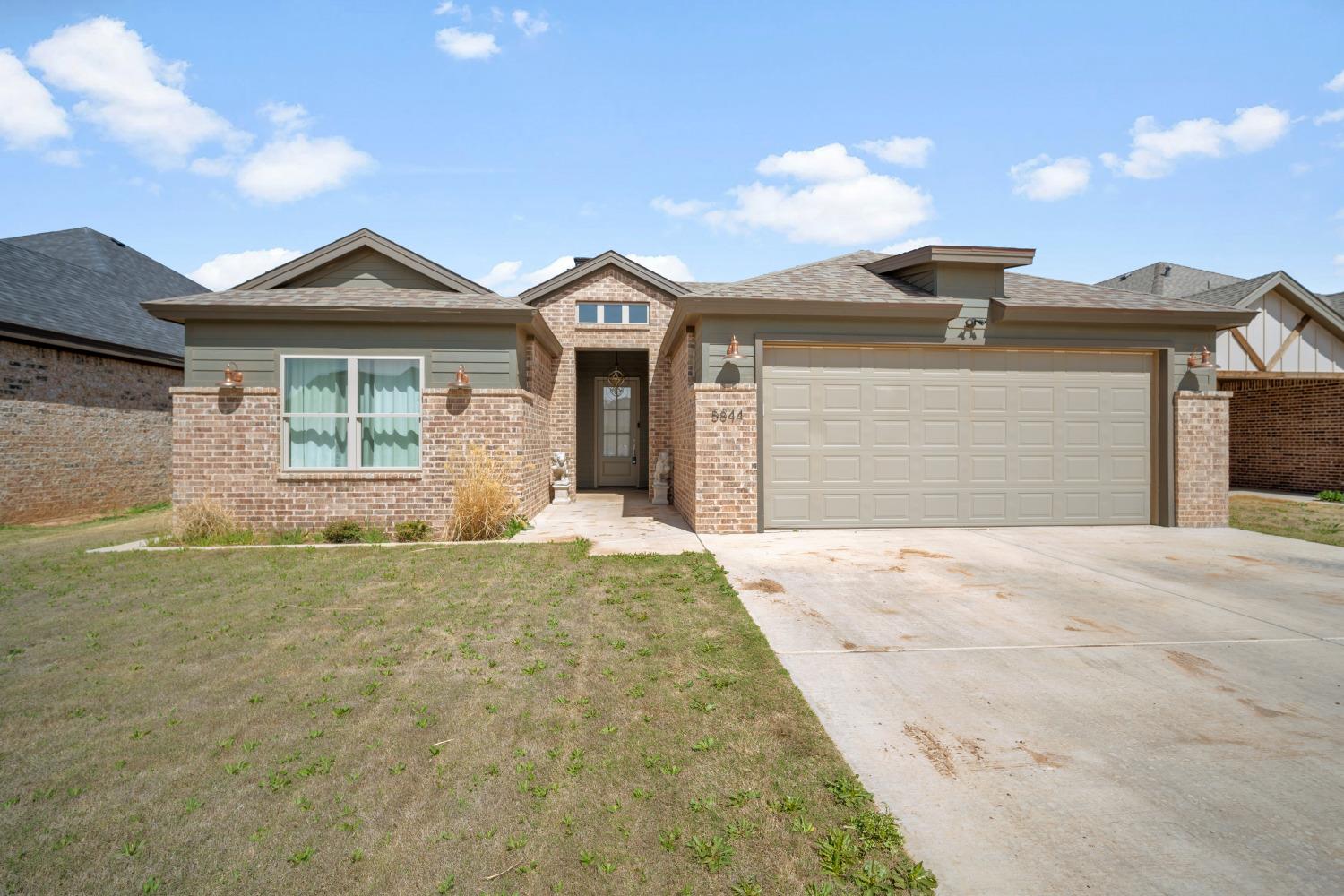 a front view of a house with yard