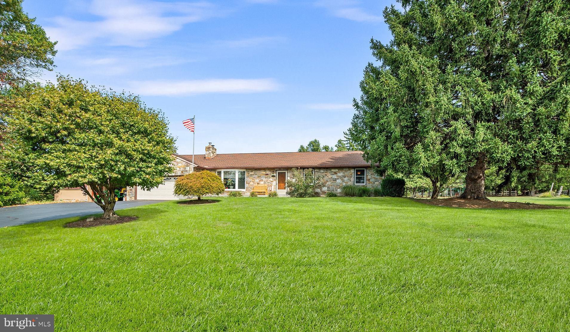 a view of a big yard next to a house