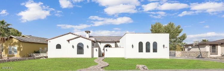 a view of house with yard