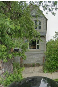 a view of a house with a tree